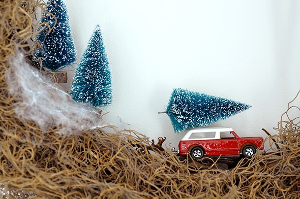 Make this easy rustic vintage Christmas wreath with bottle brush trees and a toy car via http://lifeovereasy.com/