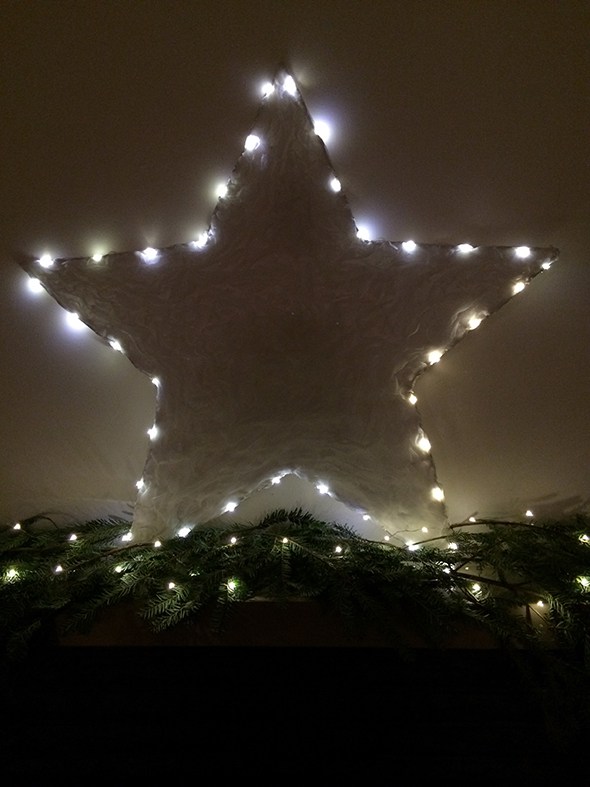 Make this beautiful DIY Fairy Light Christmas Star with a few basic supplies and a shower curtain! it will dress up your holiday mantle. Full tutorial on http://lifeovereasy.com/